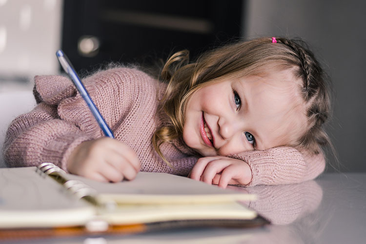 child writing - academic success